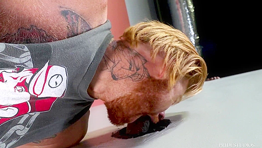 Tattooed Redhead Swallows Huge Black Cock at Glory Hole – Steamy Interracial Encounter