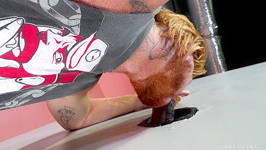 Tattooed Redhead Swallows Huge Black Cock at Glory Hole – Steamy Interracial Encounter